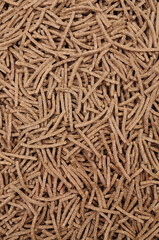 High fibre bran sticks breakfast cereal background texture detail