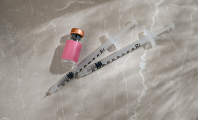 Close up of Glass Vials with Single Use Syringes