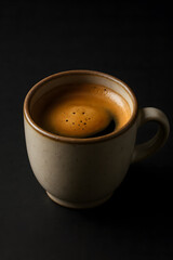 Fototapeta premium Hot Espresso Coffee in Ceramic Mug on Dark Background