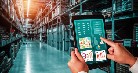 Naklejka na ściany i meble Warehouse management innovative software in computer for real time monitoring of goods package delivery . Computer screen showing smart inventory dashboard for storage and supply chain distribution .