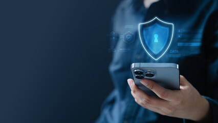 A digital privacy and security concept showing a glowing shield hologram above a smartphone, representing data protection, encryption, secure communication.