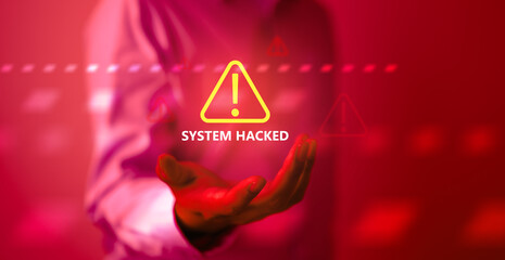 A cybersecurity alert concept showing a glowing warning icon and “SYSTEM HACKED” text on a red background, representing cyber attacks, system breaches, digital threats, and data security risks.