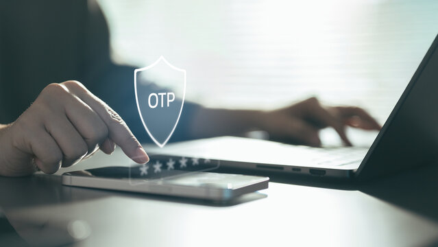 Hand entering a one-time password (OTP) on a smartphone with a security shield icon, representing two-factor authentication, secure login, identity verification, and cybersecurity protection.