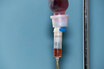 Transfusion and Medical Care. Infusion of medicines or blood on a blue background.