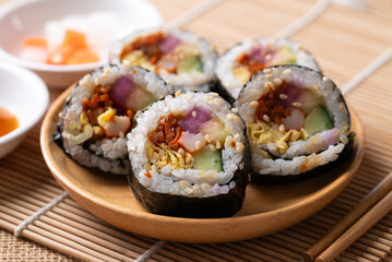 Kimbap or Gimbap, Korean food made from cooked rice with vegetables, egg and wrapped with dried seaweed