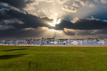 Boats and yachts docked on the Newport Bay at Marina Park in Newport Beach California USA