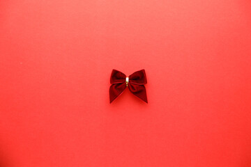 Red ribbon on red color background. Christmas decoration concept.