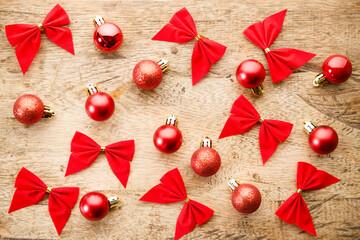 Red ribbons on wooden background. Christmas decorations concept.