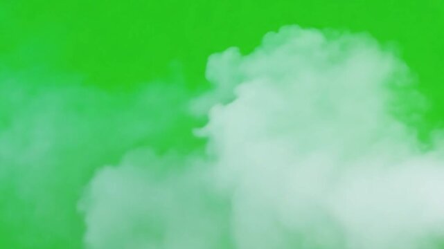 Abstract vapor on a Vibrant canvas: An abstract image features a mass of dense, billowing vapor, set against a lively green backdrop, evoking a sense of mystery and transition.