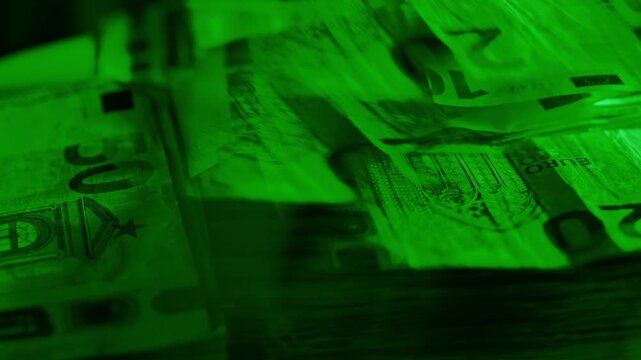 Green Lit Euro Bills on Spinning Platform Evoke Crypto Scheme Deception Mood