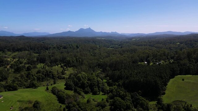 Left to right aerial view of Mt Warning, Wollumbin on a sunny day, Northern New South Wales, Australia.