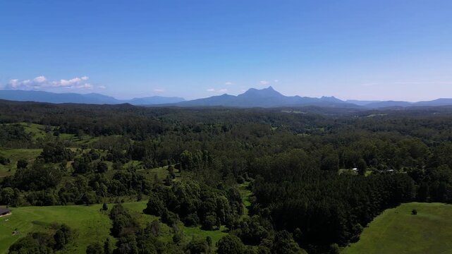 Right to left aerial view of Mt Warning, Wollumbin on a sunny day, Northern New South Wales, Australia.