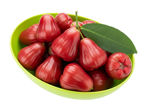 A fresh rose apple on a green oval bowl, white background isolated