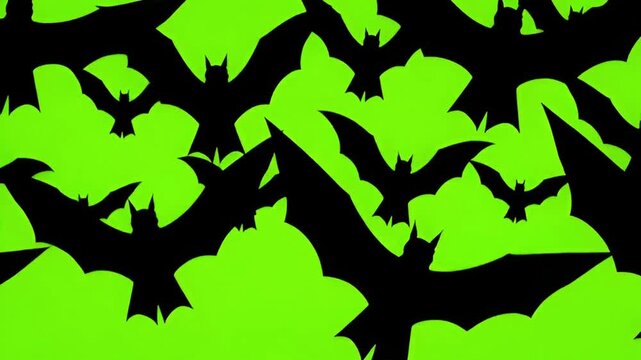 Black bat silhouettes flying against a vibrant green background perfect for Halloween decorations or spooky design projects