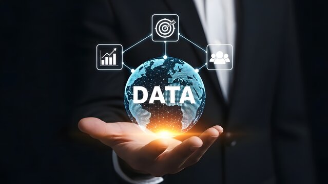Businessman holding a glowing globe with the word data and icons representing analytics, security, and connectivity - Powered by Adobe