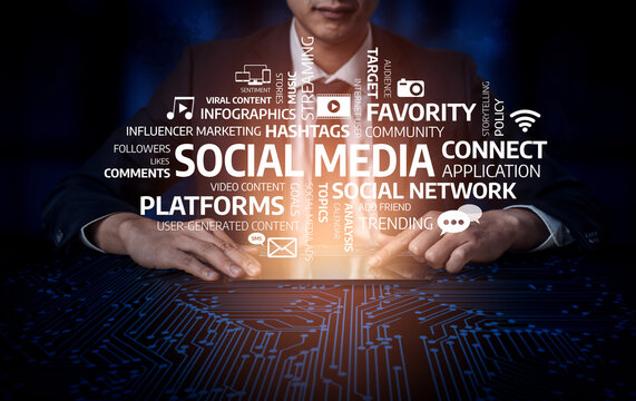 A businessman focuses on social media trends and digital marketing, featuring keywords that symbolize online engagement, community, and strategic planning. Tessel - Powered by Adobe