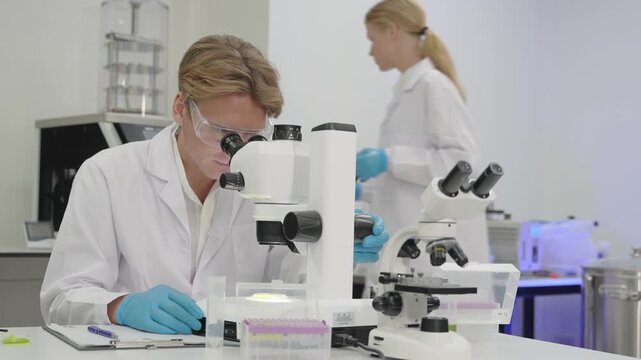 Laboratory technicians analyzing samples in a modern research facility during daytime