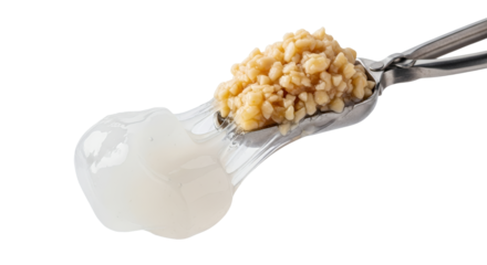 Scoop of molecular gastronomy pearls resting with a gelatinous mass, showcasing culinary science with delicate textures and contrasts against a