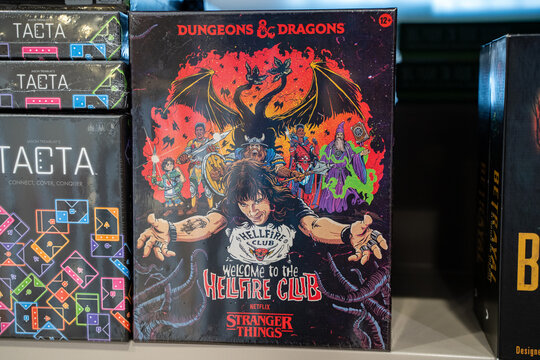 View of Dungeons and Dragons Hellfire Club board game box on store shelf. Toronto, Canada - December 3, 2025.
