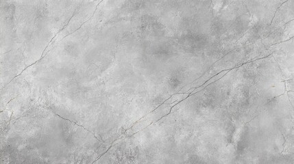 A smooth gray marble surface is illuminated by natural light, showcasing subtle patterns and delicate veins. The appearance conveys a serene and elegant ambiance.