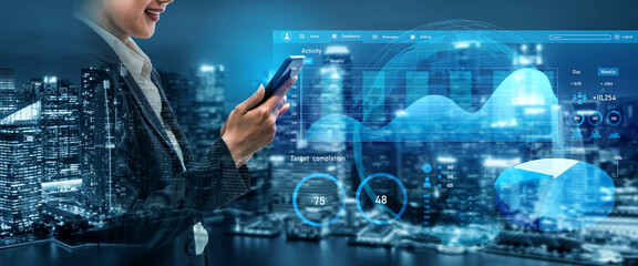 A business professional interacts with a smartphone displaying digital analytics in a vibrant urban setting, showcasing modern technology and data-driven insights. Impute
