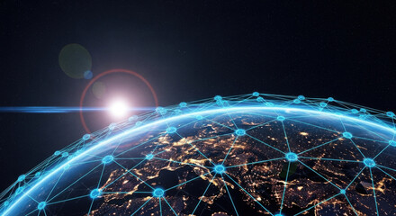A global communication network with glowing blue lights surrounds the Earth at night, illustrating worldwide connectivity, data, and technology.