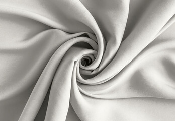 Soft white fabric folds swirl into an elegant drape for a calm minimalist background Demonstration Color of the Year 2026