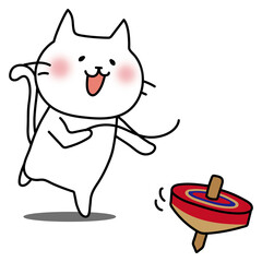 コマ回しをして遊ぶ白い猫