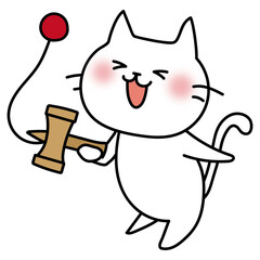 けん玉で遊ぶ白い猫