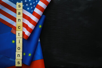 Geopolitical Sanctions Concept with USA, EU, and Russian Flags on Black Background