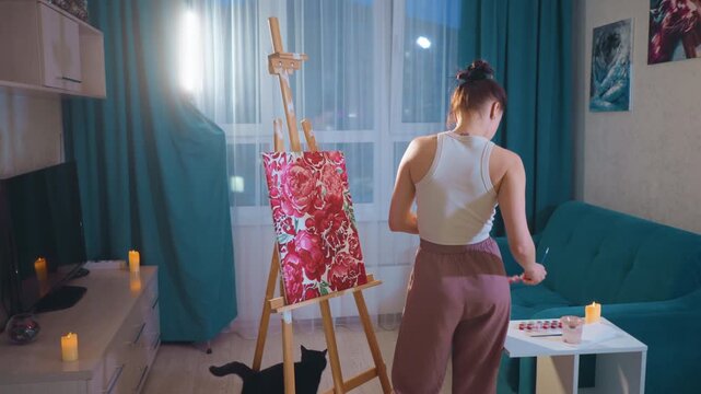 Young Caucasian Woman Painting With Bold Strokes, Freelance Illustrator Testing Vibrant Palette In Cozy Living Room Studio, Dynamic Brush Motion And Textured Layers, Dramatic Backlight And Window