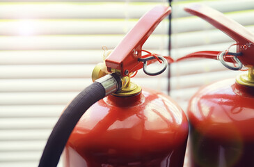 Fire extinguisher has hand engineer inspection checking pressure gauges to prepare fire equipment for protection and prevent emergency and safety rescue and alarm system training concept.