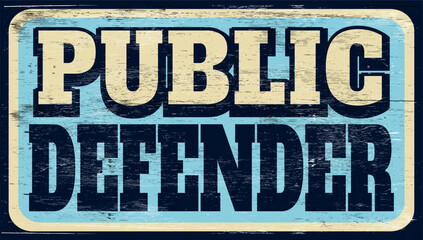 Aged retro public defender sign on wood