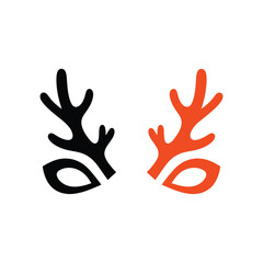 a striking visual composition displays two stylized deer antler forms one rendered in black and the other in vibrant orange presented side by side