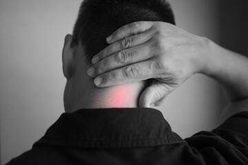 Neck Pain Concept – Man Holding Neck with Muscle Tension Highlighted in Red