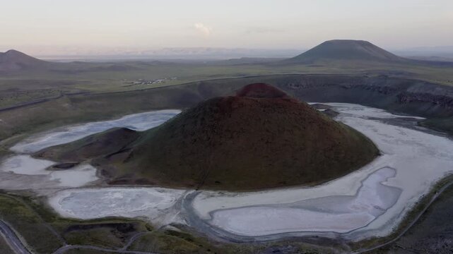 Aerial orbital view of volcano crater and dried lake at sunset, Turkey