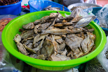 Close Up Fresh Dried Fish in Green Basket at Traditional Market