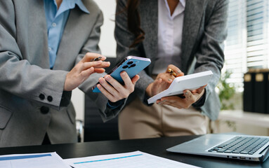 Team business meeting presentation. Hand businessman working project in modern office.Laptop computer and tablet and smart phone on white desk