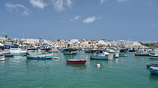 Marsaxlokk - fishing village and colorful luzzu boats. Malta.