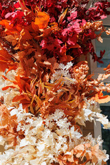 Seasonal fall foliage arrangement for festive street decor.
