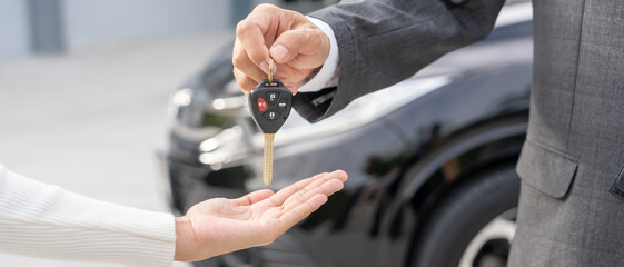 lease, rental car, sell, buy. Dealership manager send car keys to the new owner. Sales, loan credit...