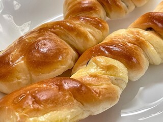 Close-Up of Freshly Baked Twisted Bread Rolls