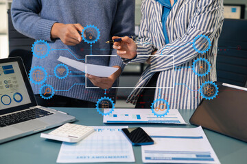 Business team working on a project in the office or reviewing and discussing a business project.