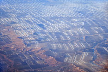 Aerial view of snow-covered fields in winter