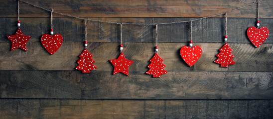 new year banner. Rustic christmas decorations hanging on wooden background. New Year's backdrop for greeting postcards