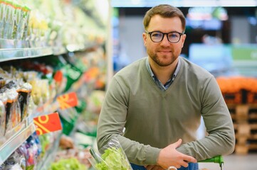 Man buying vegetables and fruit in grocery store, zero waste concept