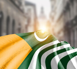 Kashmir flag fluttering on blur street with building. 5th febuary Kashmir national flag for solidarity day.