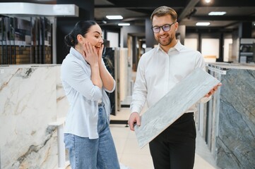 Fototapeta premium Enthusiastic customer exploring ceramic tile options