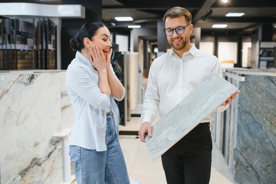 Fototapeta Enthusiastic customer exploring ceramic tile options