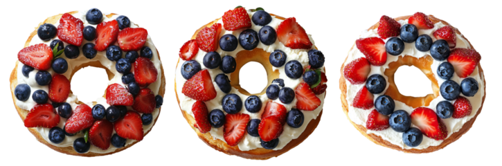 Sponge cake ring with whipped cream, topped with strawberries and blueberries, isolated on white transparent background